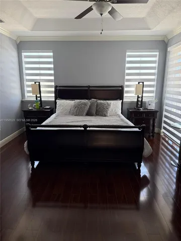 a bedroom with a bed and a chair