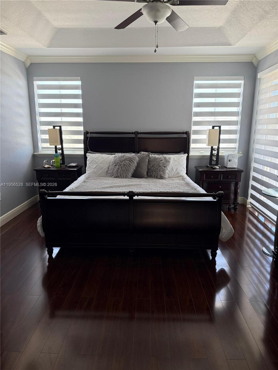 15541 Southwest 21st Terrace Miami, FL 33185 - Photo 10 of 21 a bed sitting in a bedroom next to a window