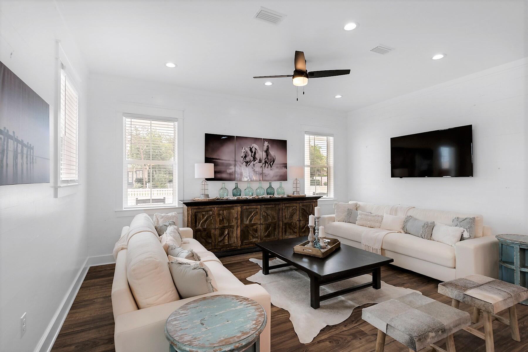 4458 Luke Avenue Destin, FL 32541 - Photo 11 of 41 a living room with furniture a flat screen tv and a window