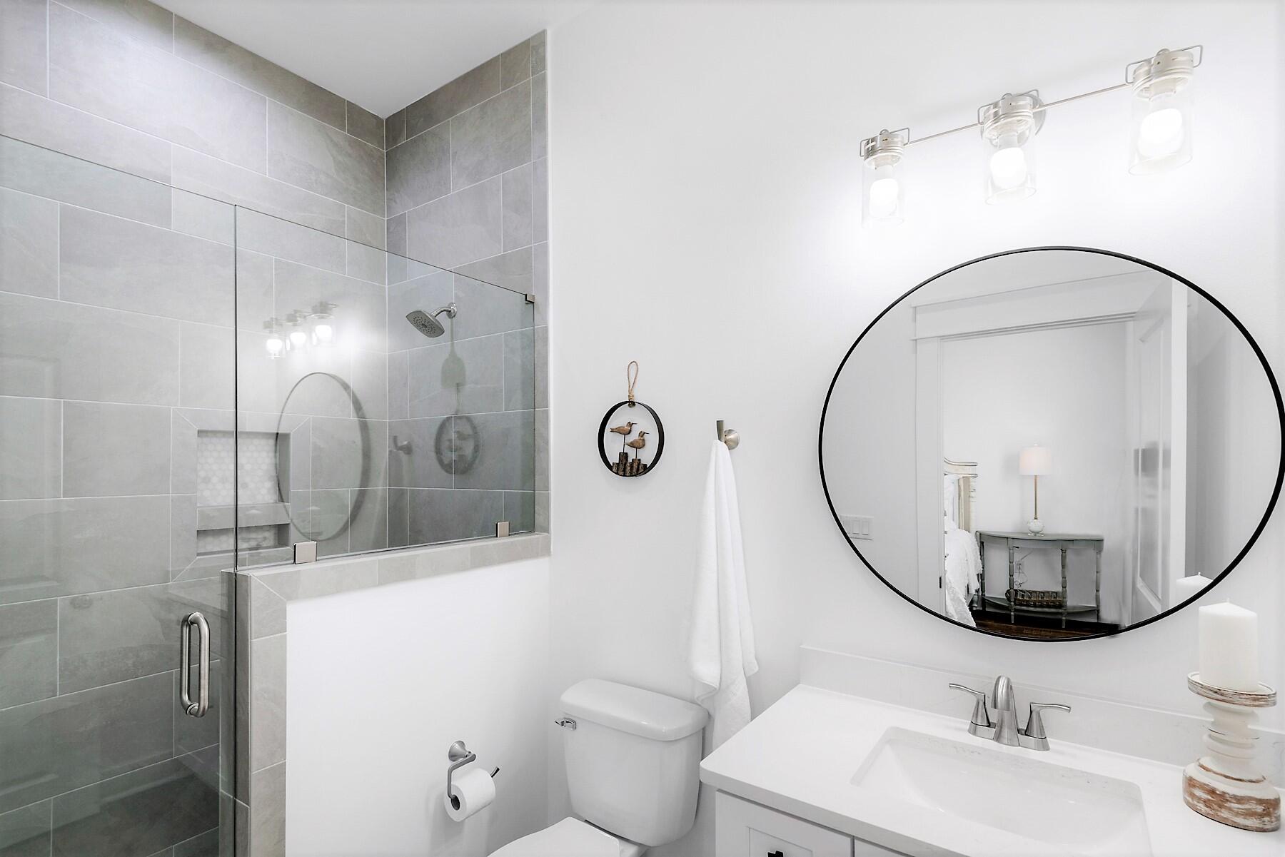 4458 Luke Avenue Destin, FL 32541 - Photo 27 of 41 a bathroom with a sink mirror and toilet
