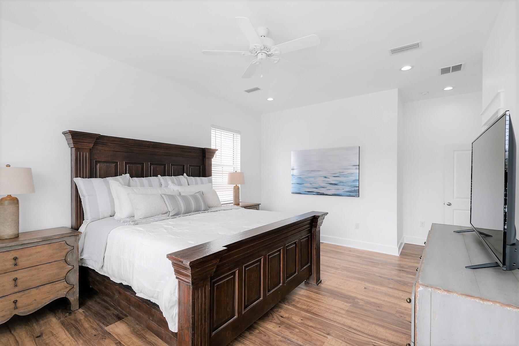 4458 Luke Avenue Destin, FL 32541 - Photo 29 of 41 a spacious bedroom with a bed and a dresser