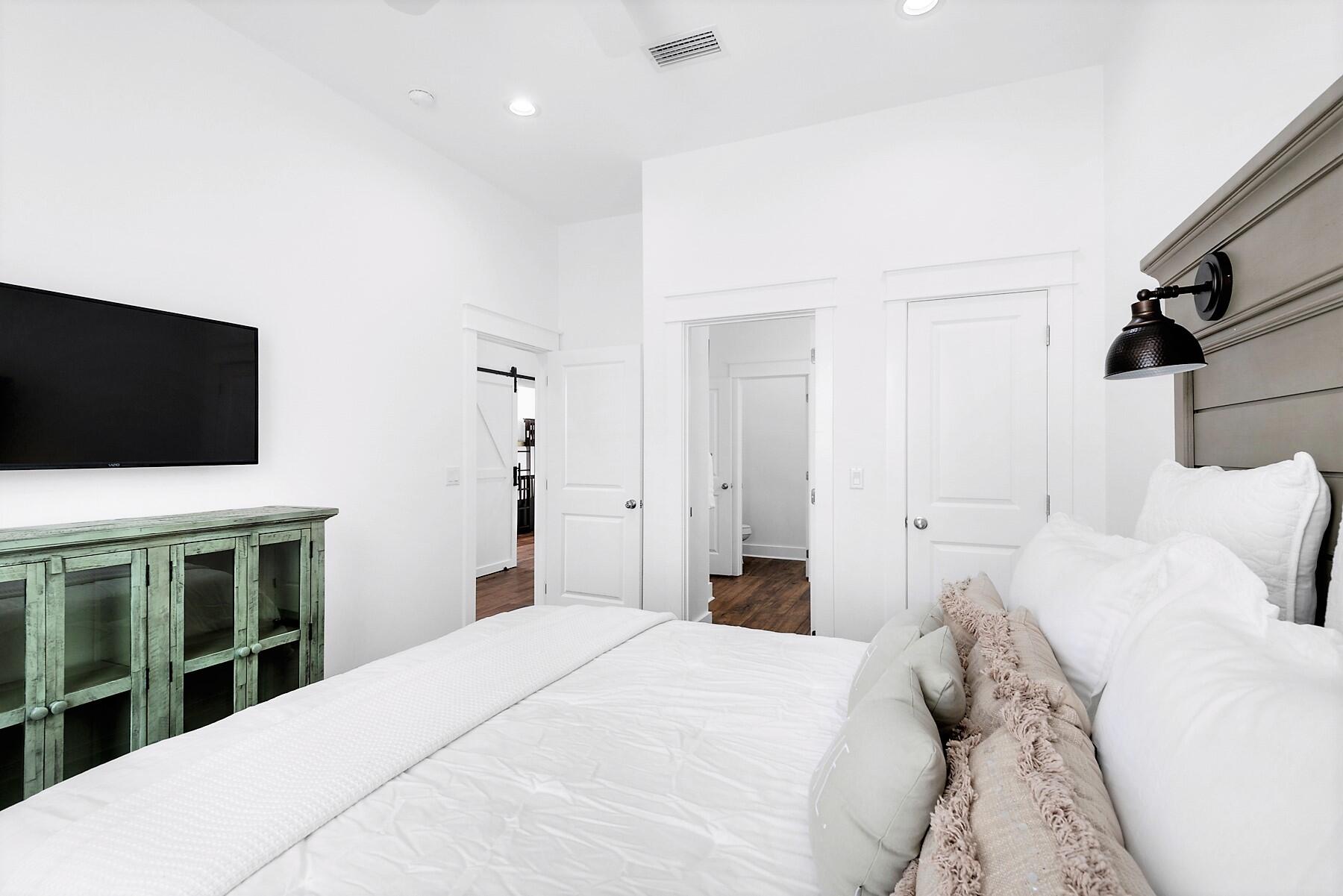 4458 Luke Avenue Destin, FL 32541 - Photo 35 of 41 a bedroom with a bed tv and a window