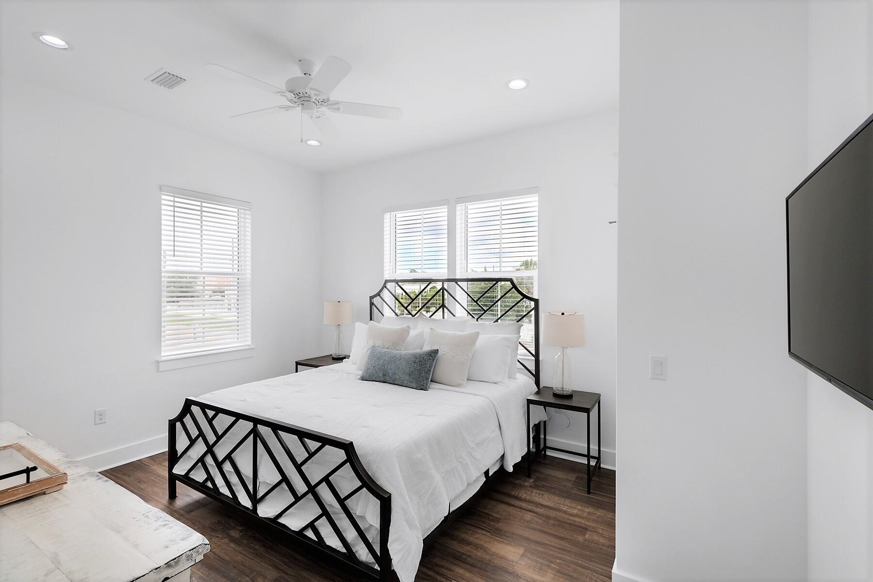 4458 Luke Avenue Destin, FL 32541 - Photo 38 of 41 a bedroom with a bed and a flat screen tv