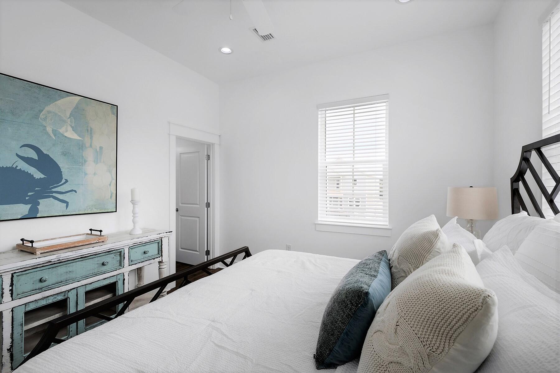 4458 Luke Avenue Destin, FL 32541 - Photo 39 of 41 a bedroom with a bed and a flat screen tv