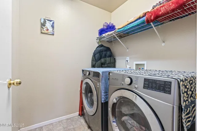 a spacious bedroom with a bed and a chandelier