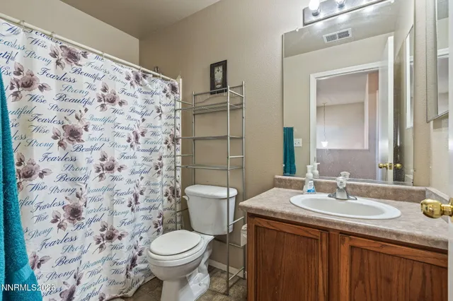 a view of a house with backyard sitting area and porch