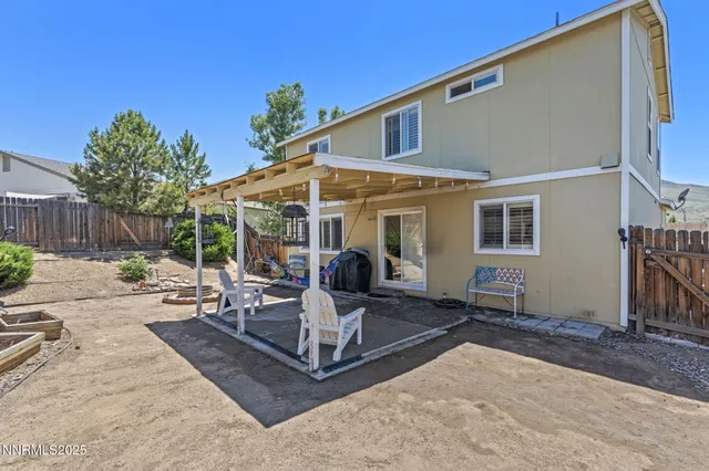 a view of a chairs and table in the patio