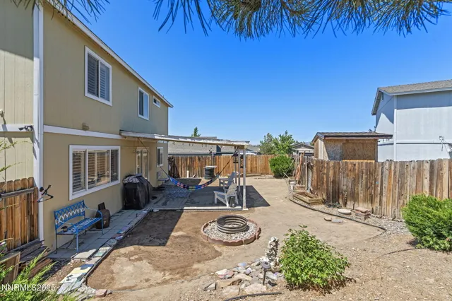 a view of a chairs and table in wooden roof