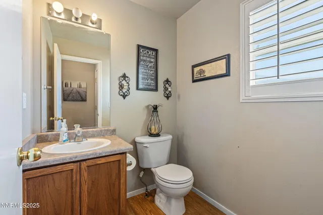a living room with furniture and a ceiling fan