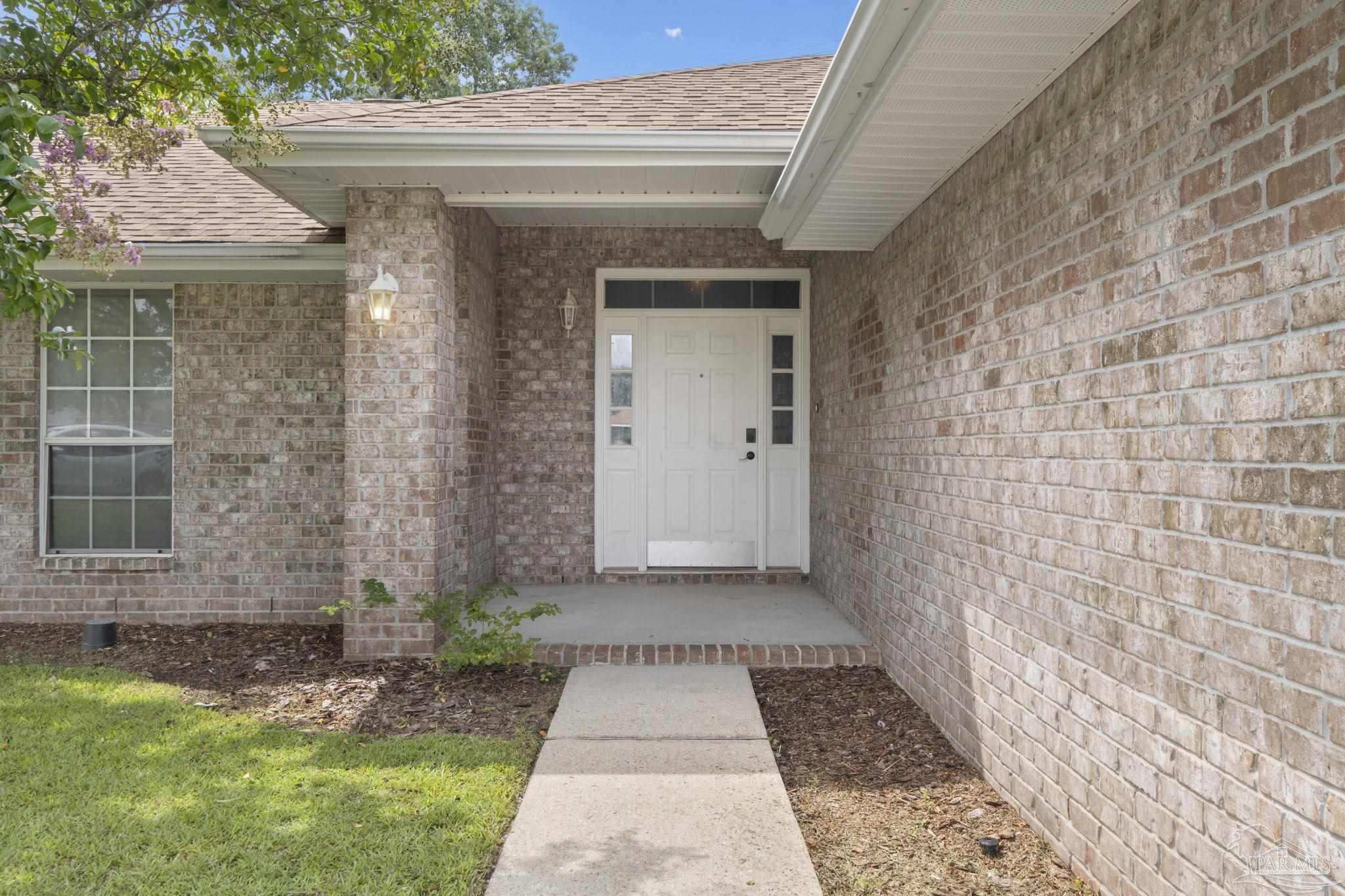 5642 Berrybrook Circle Pace, FL 32571 - Photo 2 of 72 a view of a pathway both side of house
