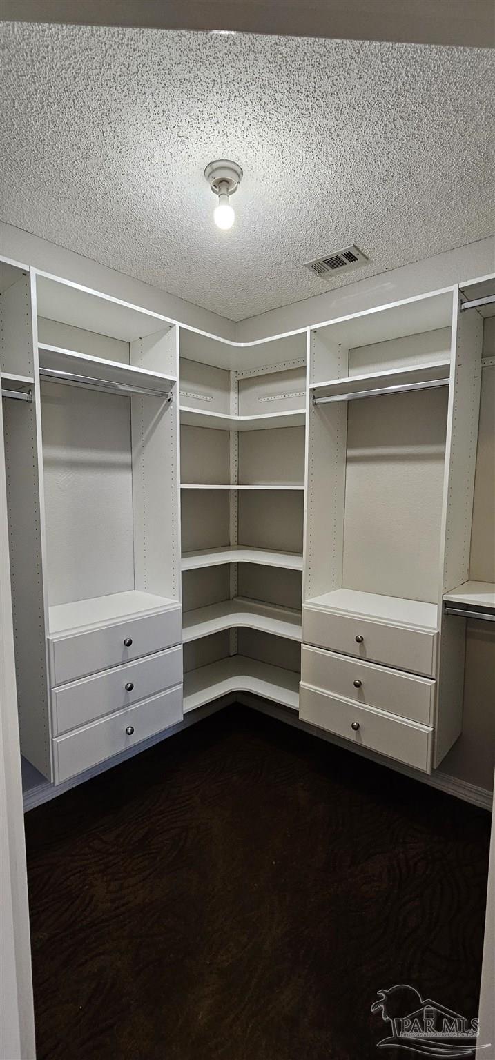 5642 Berrybrook Circle Pace, FL 32571 - Photo 21 of 72 a view of walk in closet