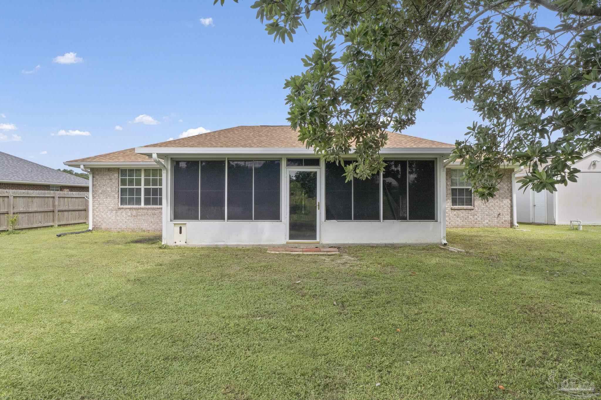 5642 Berrybrook Circle Pace, FL 32571 - Photo 33 of 72 front view of a house with a garden