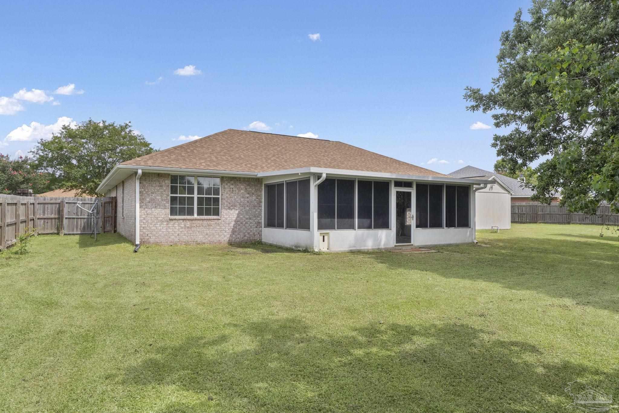 5642 Berrybrook Circle Pace, FL 32571 - Photo 35 of 72 a front view of a house with a garden