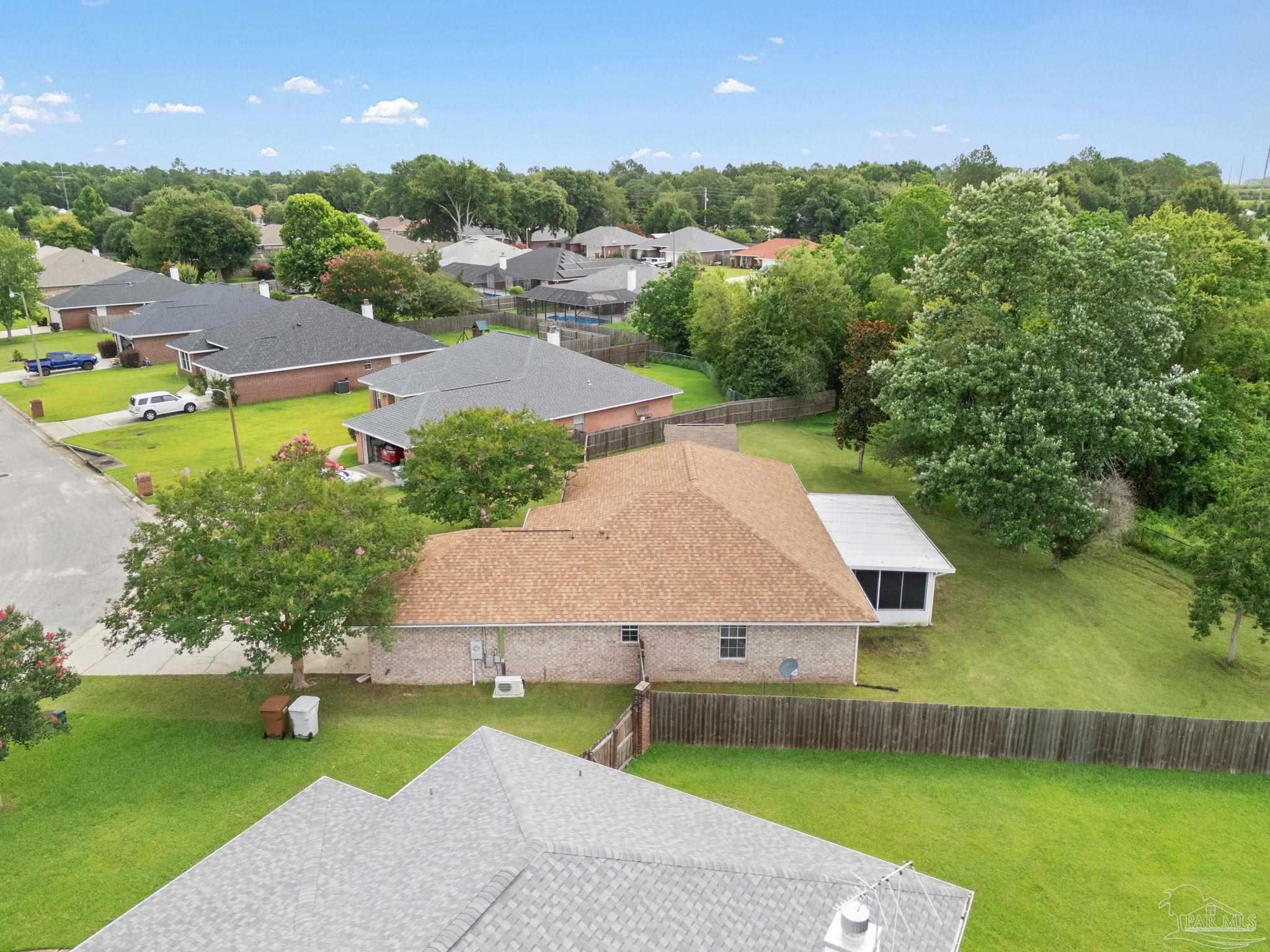 5642 Berrybrook Circle Pace, FL 32571 - Photo 42 of 72 an aerial view of a house with a garden and lake view
