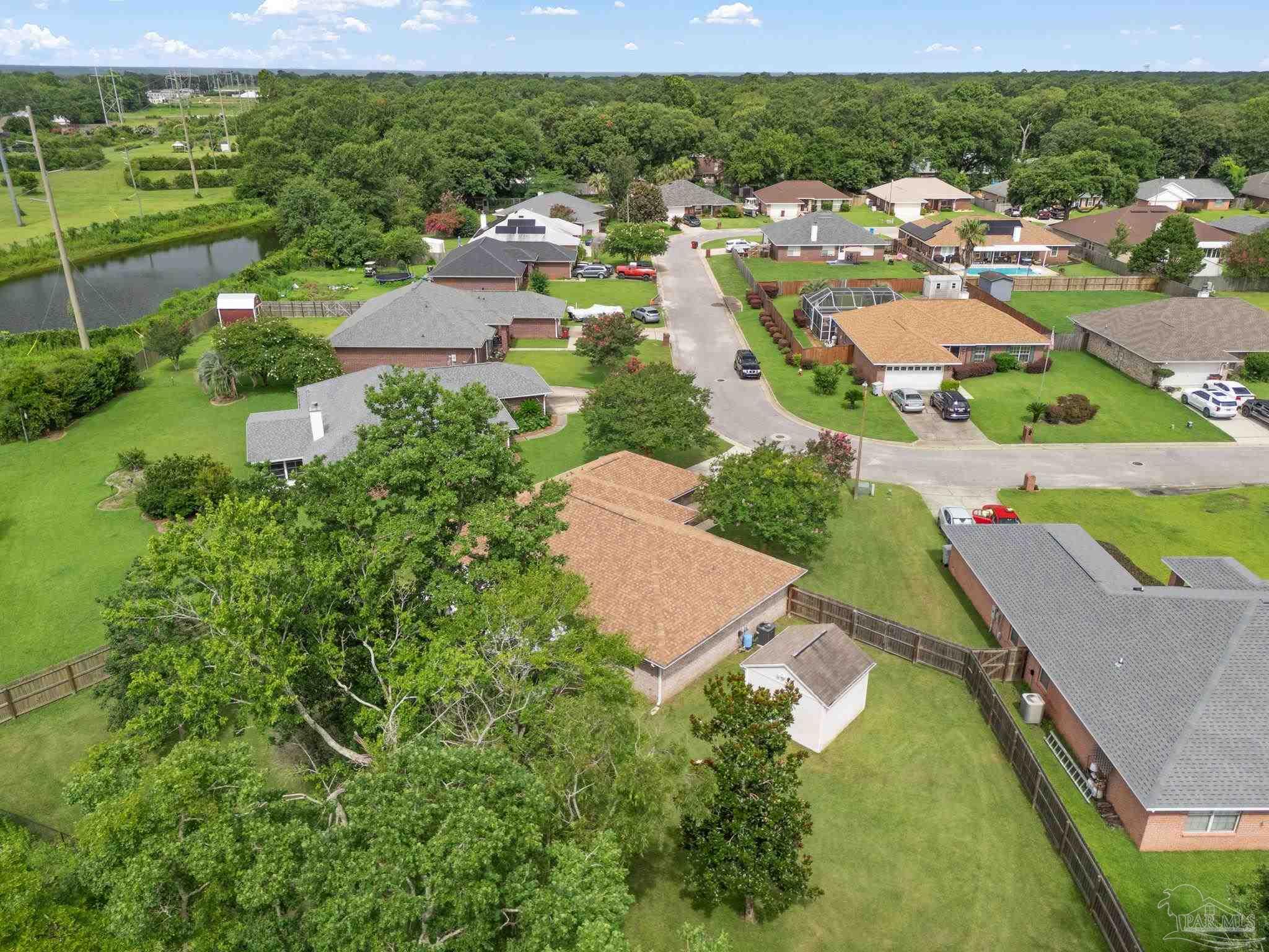 5642 Berrybrook Circle Pace, FL 32571 - Photo 44 of 72 an aerial view of residential houses with outdoor space and street view
