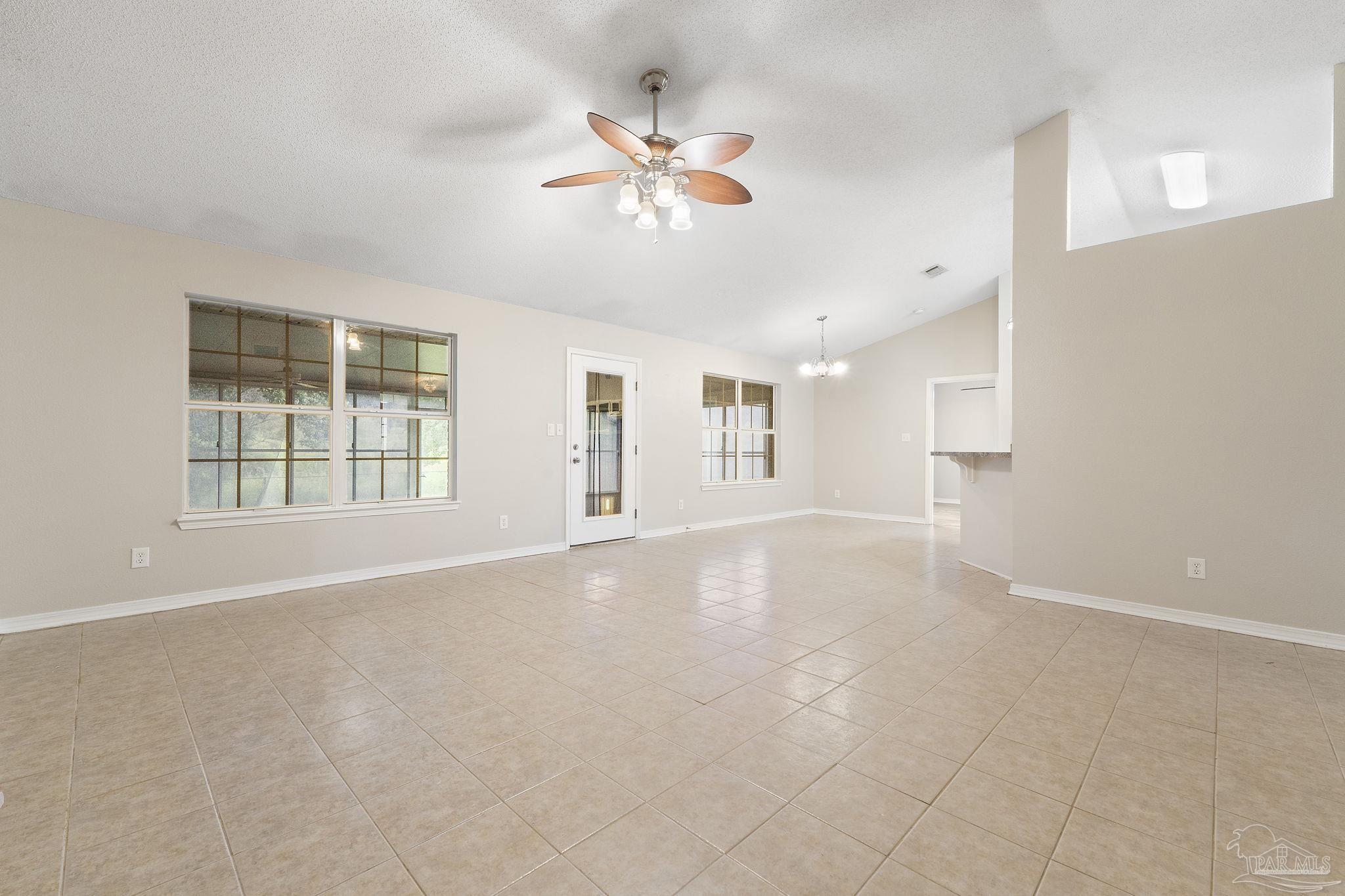 5642 Berrybrook Circle Pace, FL 32571 - Photo 7 of 72 a view of an empty room with a window