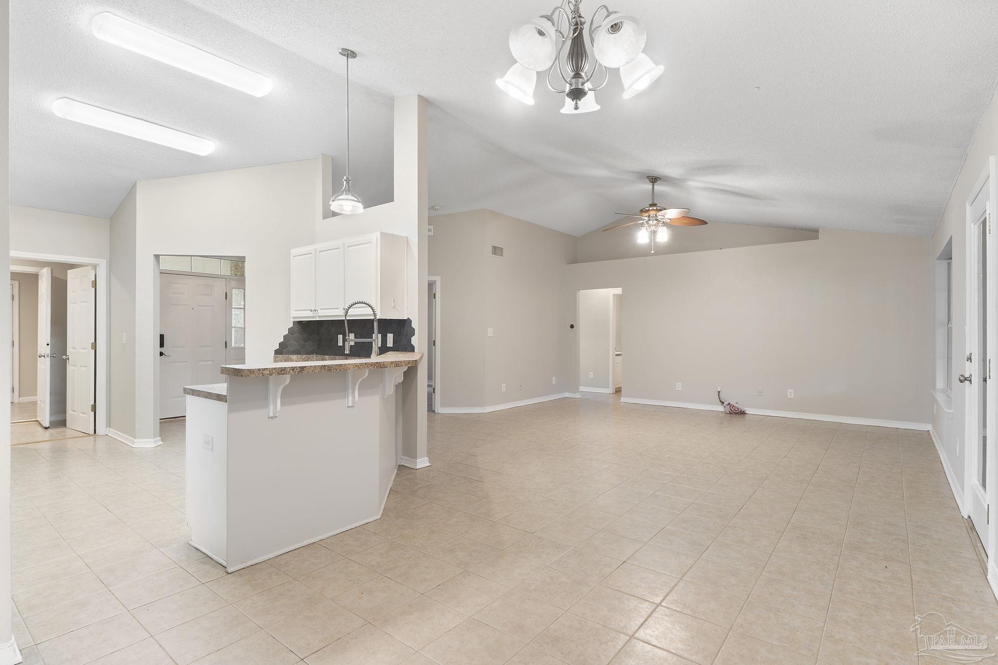 5642 Berrybrook Circle Pace, FL 32571 - Photo 10 of 72 a view of a kitchen with a sink and cabinets