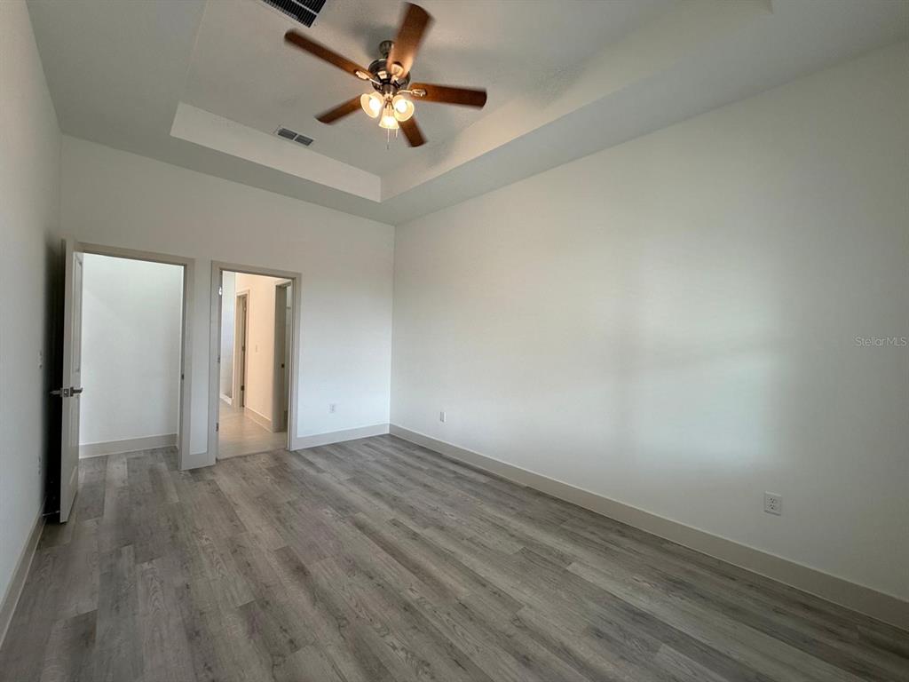 3057 Aliceville Road North Port, FL 34288 - Photo 24 of 33 wooden floor in an empty room