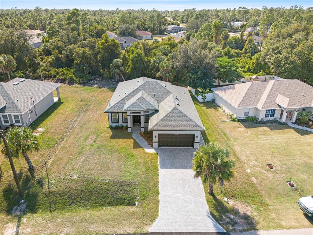3057 Aliceville Road North Port, FL 34288 - Photo 5 of 33 an aerial view of a house with a yard