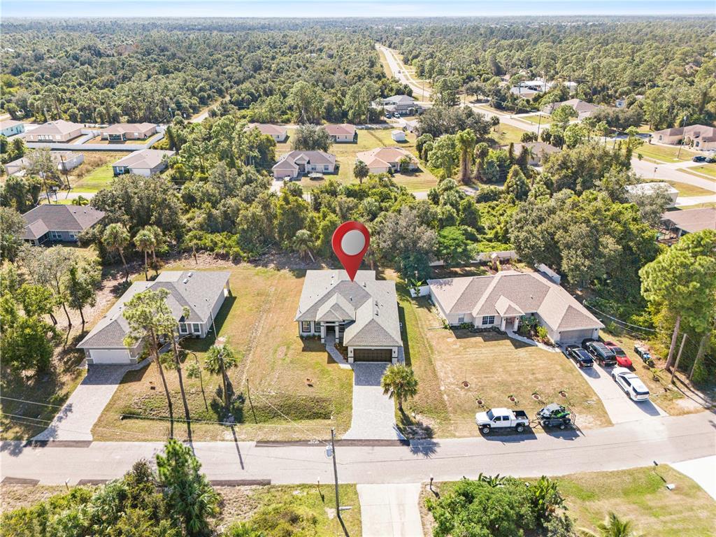 3057 Aliceville Road North Port, FL 34288 - Photo 7 of 33 an aerial view of residential houses with outdoor space