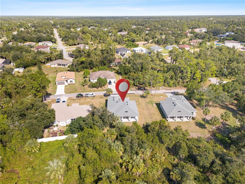 3057 Aliceville Road North Port, FL 34288 - Photo 8 of 33 an aerial view of residential houses with outdoor space and swimming pool