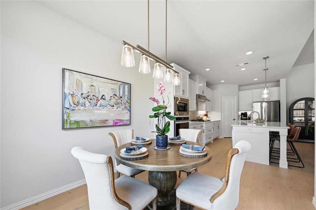 9317 Sunset Lane Oak Point, TX 75068 - Photo 11 of 40 a view of a dining room with furniture