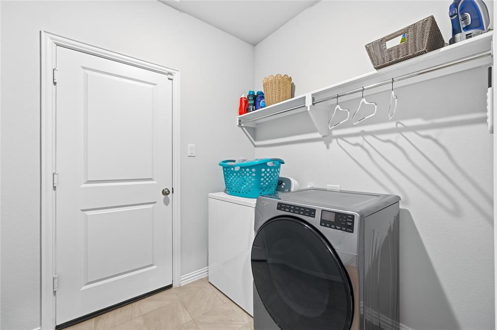 9317 Sunset Lane Oak Point, TX 75068 - Photo 24 of 40 a utility room with dryer and washer