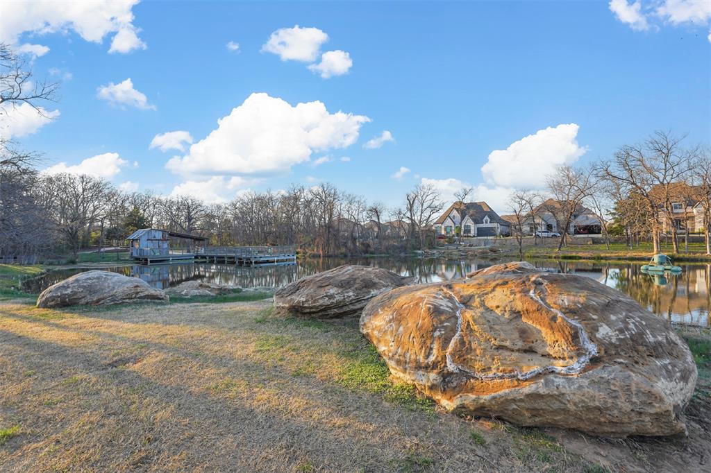 9317 Sunset Lane Oak Point, TX 75068 - Photo 35 of 40 a view of a swimming pool with a yard