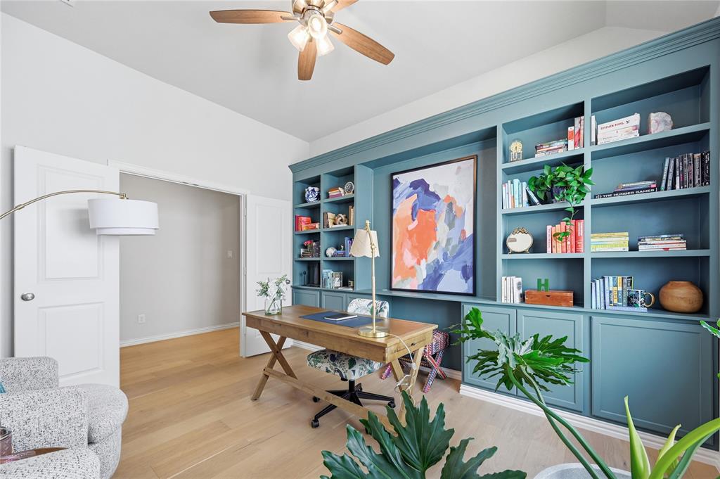 9317 Sunset Lane Oak Point, TX 75068 - Photo 4 of 40 a workspace with furniture and a book shelf