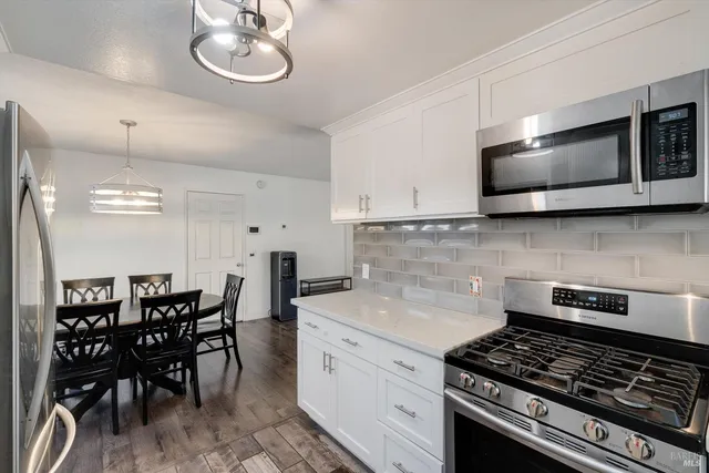 a kitchen with a stove and a microwave