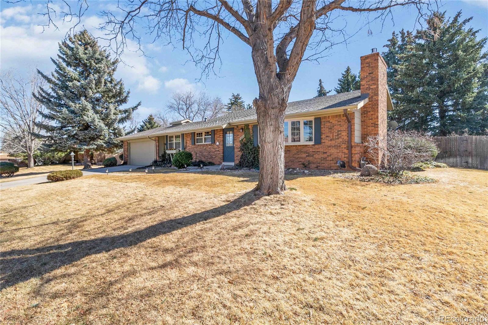 6984 Dover Way Arvada, CO 80004 - Photo 2 of 39 a view of snow on the side of the house