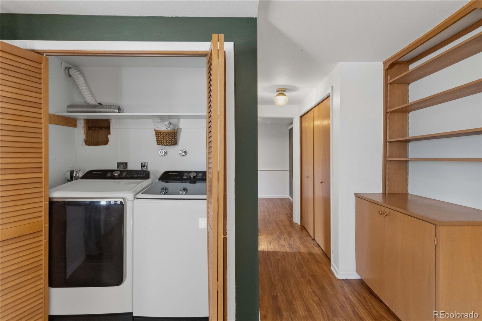 6984 Dover Way Arvada, CO 80004 - Photo 28 of 39 a view of a kitchen with washer and dryer