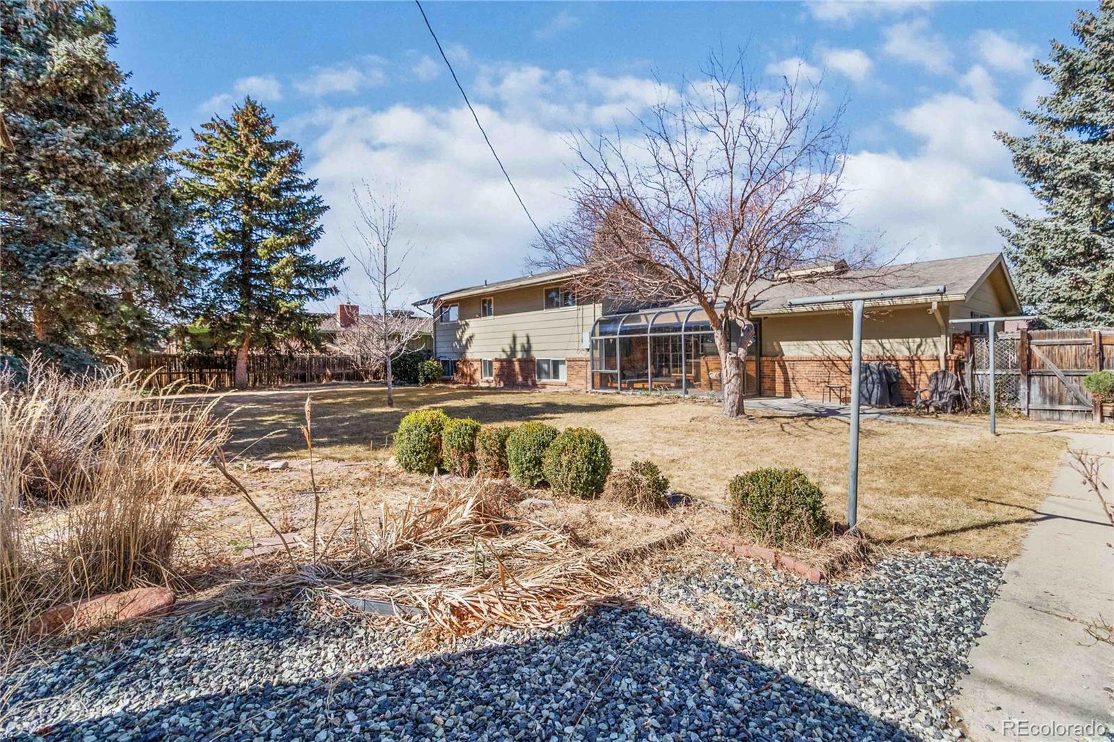 6984 Dover Way Arvada, CO 80004 - Photo 34 of 39 a view of a yard with a fountain