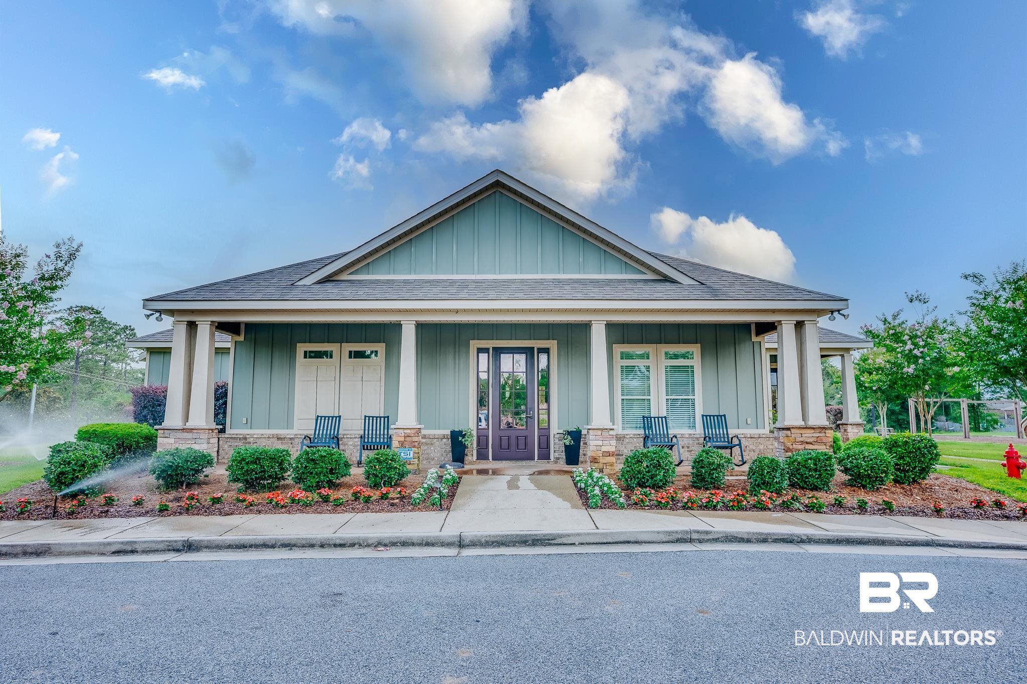 8242 Sycamore Way Semmes, AL 36575 - Photo 40 of 43 Craftsman-style home featuring roof with shingles, board and batten siding, and covered porch