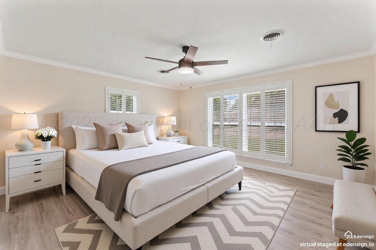 7204 Southwest 39th Avenue Amarillo, TX 79109 - Photo 25 of 51 a spacious bedroom with a large bed and a large window