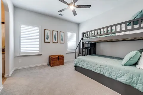 a bedroom with furniture and window