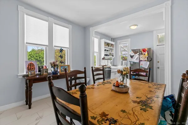 a view of a dining room with furniture window and outside view