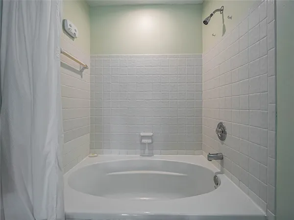 a close up of a bathtub in a bathroom