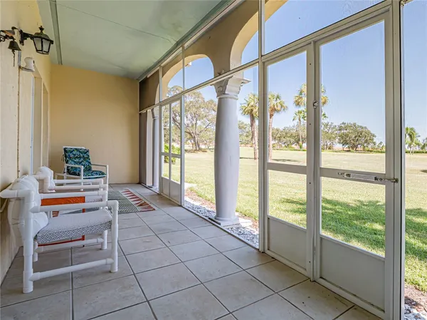 a room with a large window and a couch