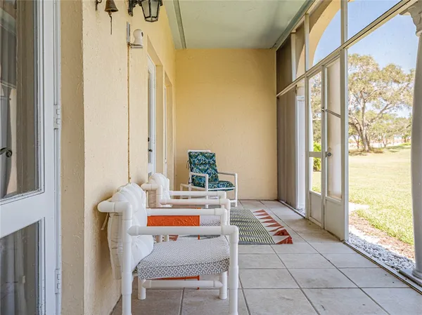 a view of living room with furniture and a window