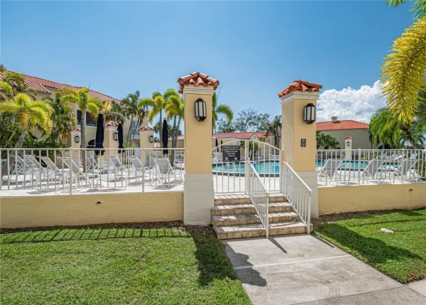 a view of a fountain in front of a house