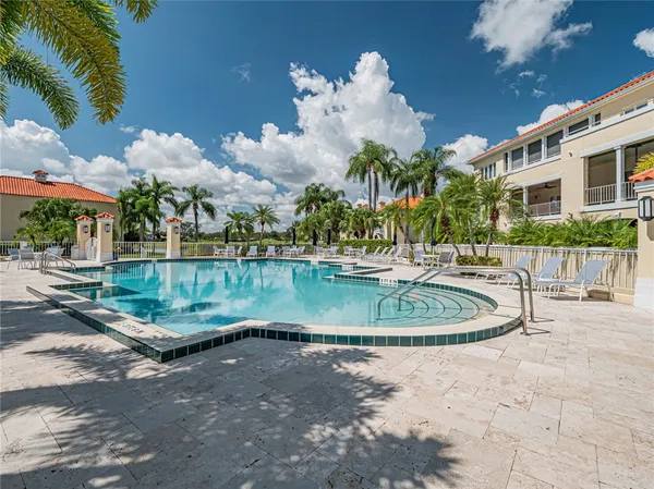 a swimming pool with outdoor seating