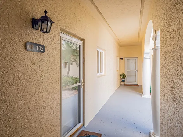 a hallway with sliding door and stairs