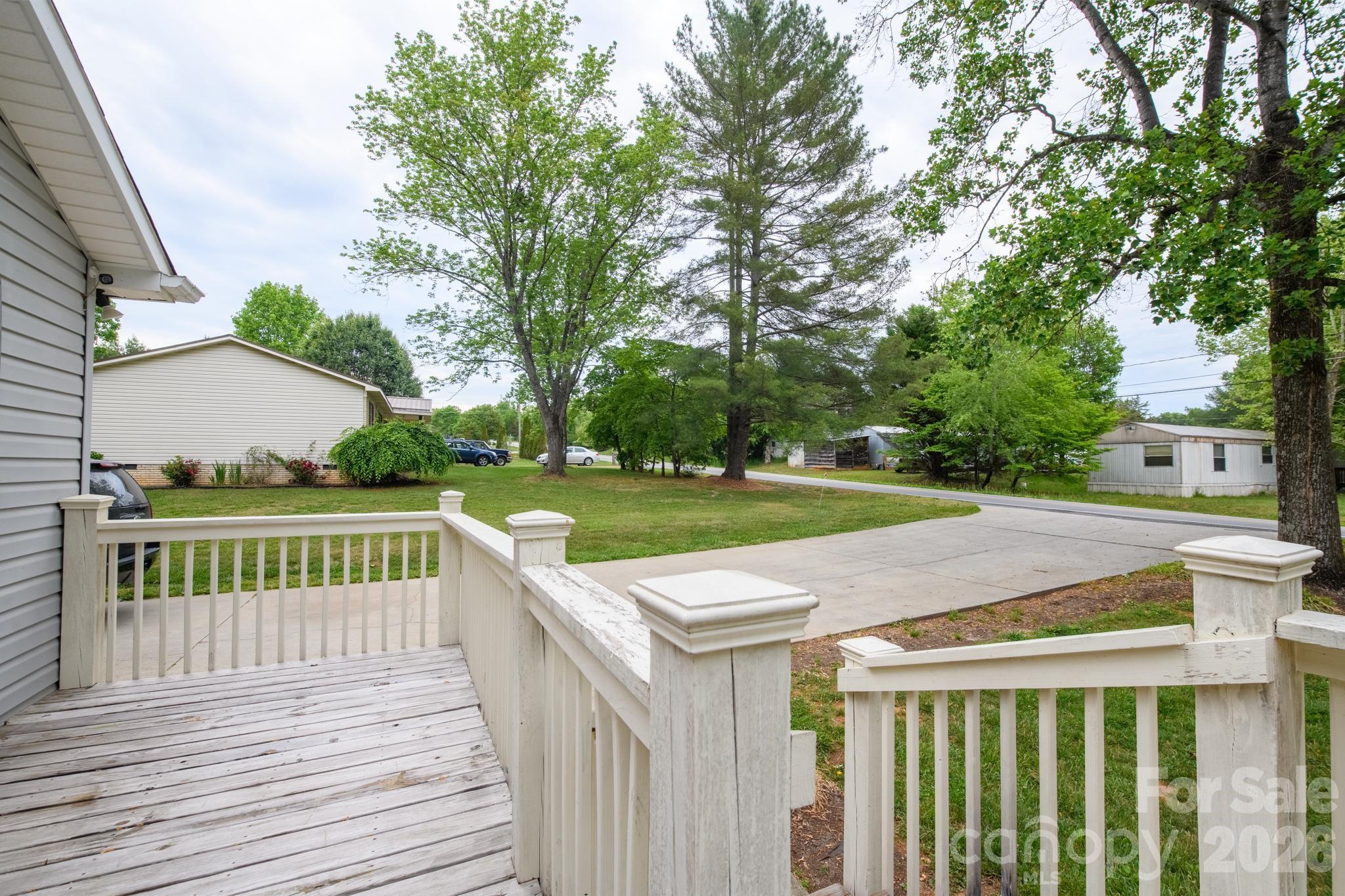 2308 Walt Arney Road Lenoir, NC 28645 - Photo 14 of 37 a view of a house with backyard and trees