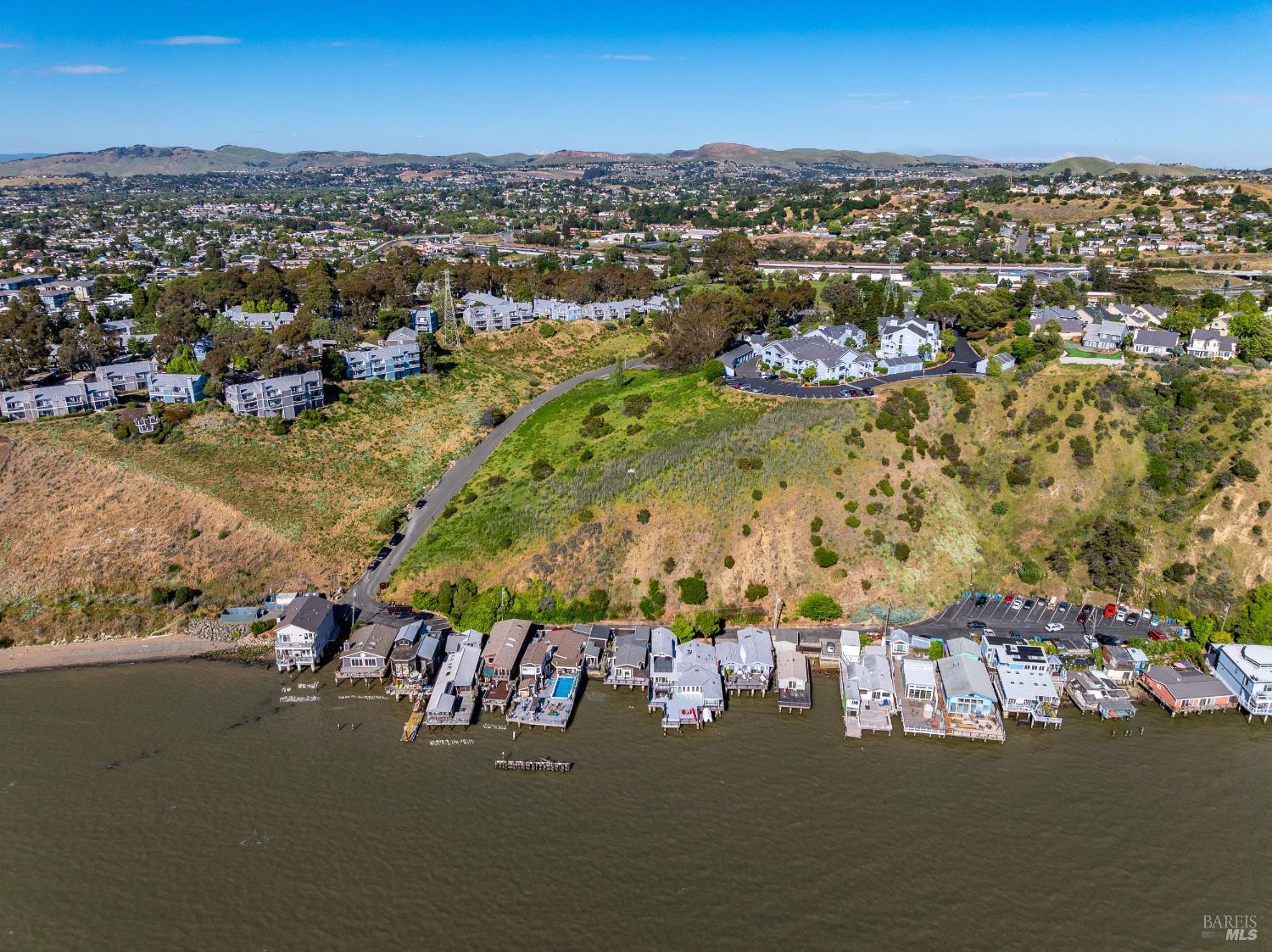 201 Sandy Beach Road Vallejo, CA 94590 - Photo 6 of 32 an aerial view of a city with lots of residential buildings ocean and mountain view in back