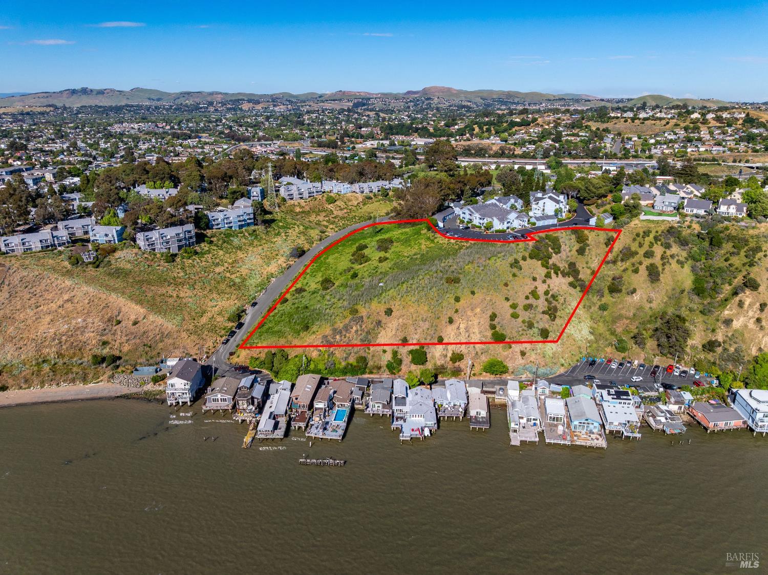 201 Sandy Beach Road Vallejo, CA 94590 - Photo 7 of 32 an aerial view of a city with lots of residential buildings ocean and mountain view in back