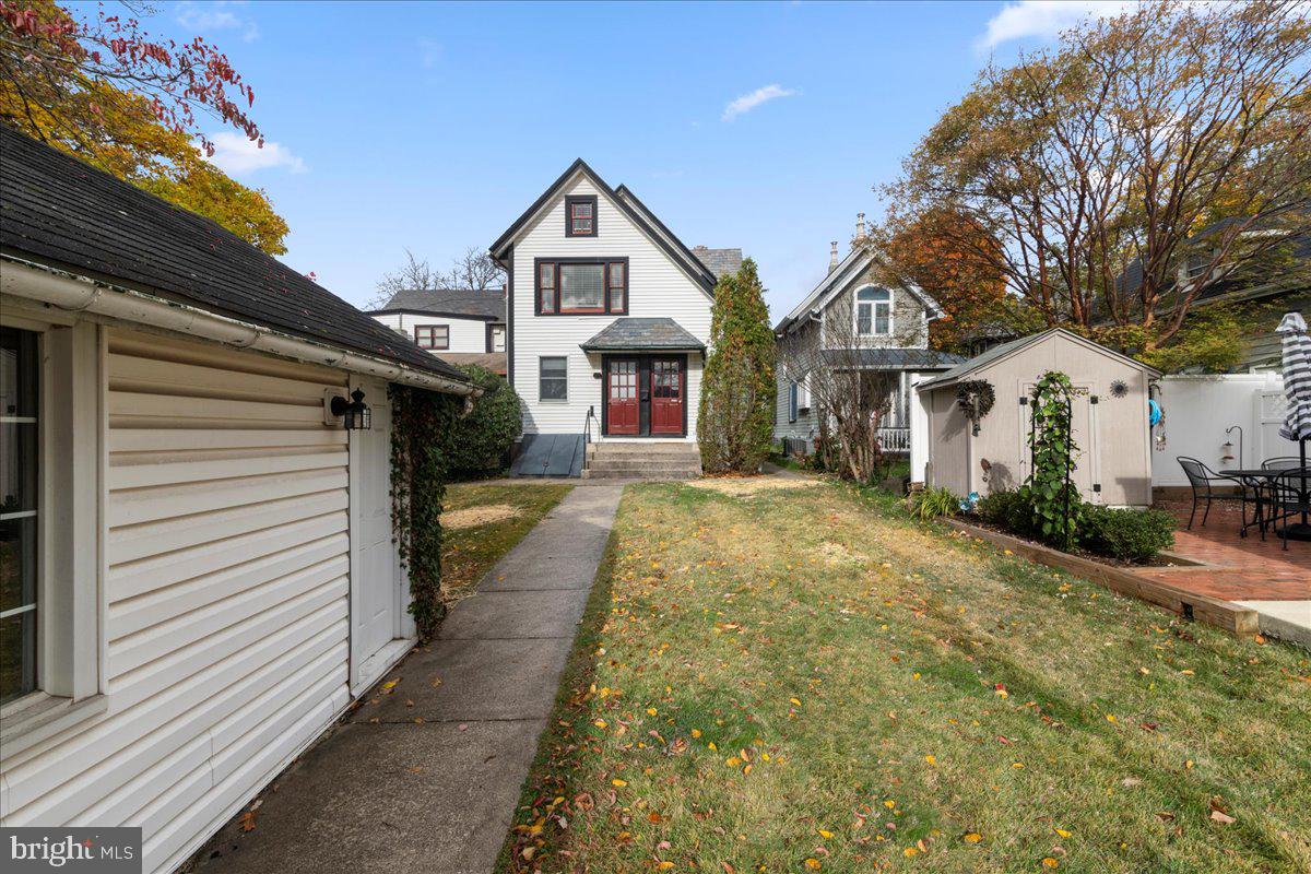 182 West Court Street, Unit 180 Doylestown, PA 18901 - Photo 18 of 24 a view of a white house with a small yard and large trees