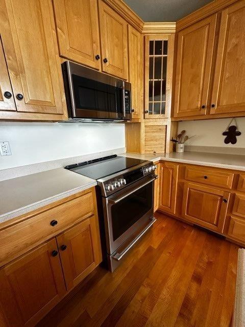 1321 Freeport Road Natrona Heights, PA 15065 - Photo 26 of 43 a kitchen with wooden cabinets and a stove top oven