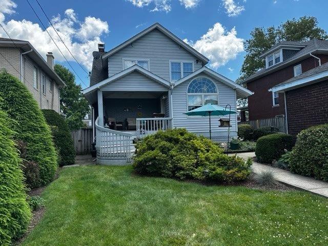 1321 Freeport Road Natrona Heights, PA 15065 - Photo 5 of 43 a front view of a house with a yard and garage