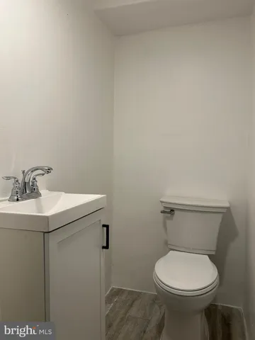 a bathroom with a toilet and a sink